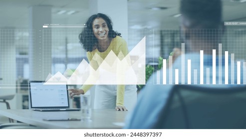 Image of financial data processing over diverse business people working in office. Global business, finances, computing and data processing concept digitally generated image.