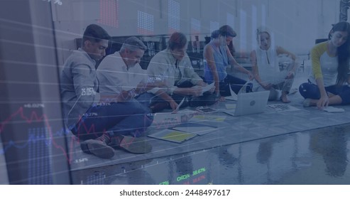 Image of financial data processing over diverse group of business people reading. global business, finances and digital interface concept digitally generated image.