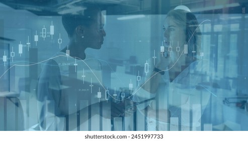 Image of financial data processing over diverse business people in office. Global business and digital interface concept digitally generated image.