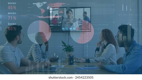 Image of financial data processing over diverse businesspeople in office. Global business, finances, computing and data processing concept digitally generated image.