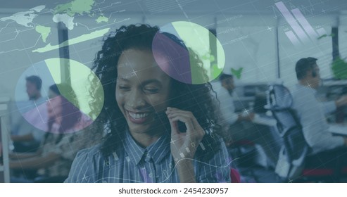 Image of financial data processing over biracial businesswoman in office. Global business, finances, computing and data processing concept digitally generated image.