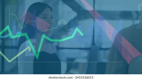 Image of financial data processing over diverse business people in office. Global business and digital interface concept digitally generated image.