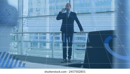 Image of financial data processing over biracial businessman using smartphone. global business, finances, data processing and digital interface concept digitally generated image.