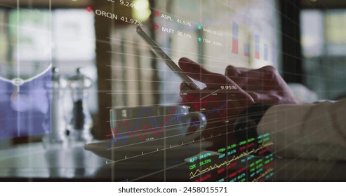 Image of financial data processing over caucasian man using tablet. Global business, computing, networks, digital interface and data processing concept digitally generated image.