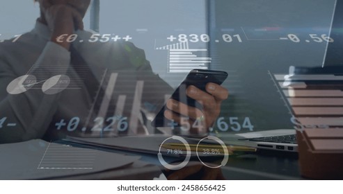 Image of financial data processing over caucasian businessman using smartphone. Global business, networks, connections, computing and data processing concept digitally generated image.