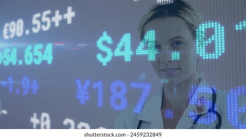 Image of financial data processing over caucasian female doctor in hospital. Global medicine, business, connections, computing and data processing concept digitally generated image.