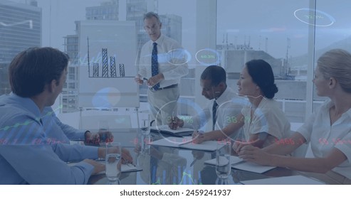 Image of financial data processing over diverse business people in office. Global business, finance, computing and data processing concept digitally generated image.