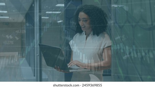 Image of financial data processing over biracial businesswoman using laptop. Global business, finance, computing and data processing concept digitally generated image. - Powered by Shutterstock - Get 15% off with code: PIKWIZARD15