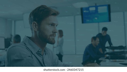 Image of financial data processing over caucasian man talking on phone at office. Global finance and business technology concept