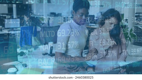 Image of financial data processing over diverse business people in office. Global business, finance, computing and data processing concept digitally generated image. - Powered by Shutterstock - Get 15% off with code: PIKWIZARD15