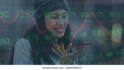 Image of financial data processing over businesswoman using smartphone. Global business, finance, computing and data processing concept digitally generated image.