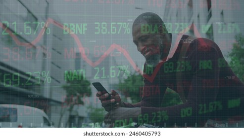 Image of financial data processing over businessman using smartphone. Global business, finance, computing and data processing concept digitally generated image.