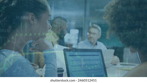 Image of financial data processing over diverse business people. Global business, finances, computing and data processing concept digitally generated image.