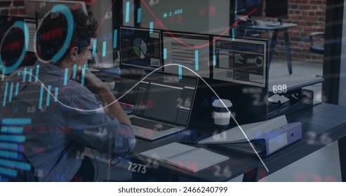 Image of financial data processing over caucasian businessman using laptop. Global business, finances, computing and data processing concept digitally generated image.