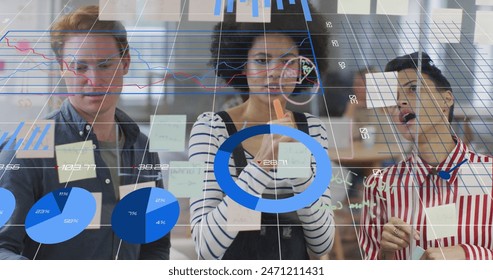 Image of financial data processing over diverse business people. Global business, finances and digital interface concept digitally generated image.