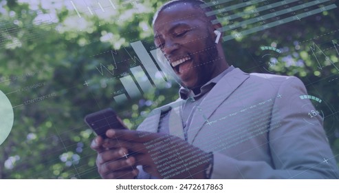 Image of financial data processing over african american businessman using smartphone. Global finance, business, connections, computing and data processing concept digitally generated image.