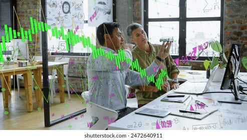 Image of financial data processing over diverse business people working in office. Global business, finances, computing and data processing concept digitally generated image.
