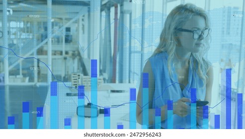 Image of financial data processing over caucasian businesswoman in office. Global computing, digital interface and data processing concept digitally generated image.