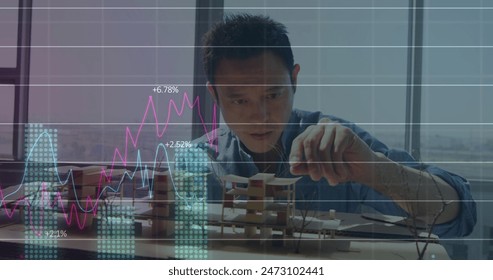 Image of financial data processing over asian businessman. Global finances, business and digital interface concept digitally generated image.