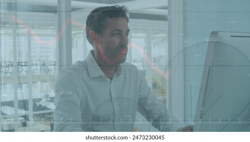 Image of financial data processing over caucasian businessman using computer in office. Global networks, computing, business, finance and data processing concept digitally generated image.