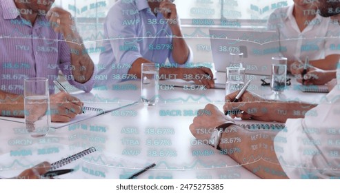 Image of financial data processing over diverse business people in office. Global business, finances, computing and data processing concept digitally generated image.