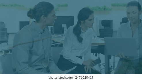Image of financial data processing over diverse business people using computer in office. Global business, finance, computing and data processing concept digitally generated image.