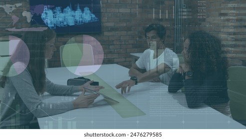 Image of financial data processing over diverse business people in office. Global computing, digital interface and data processing concept digitally generated image.