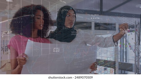 Image of financial data processing over diverse business people. Global finances, business and digital interface concept digitally generated image.