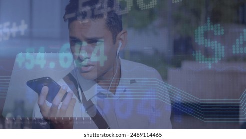Image of financial data processing over man using smartphone. Global business, finances, computing and data processing concept digitally generated image.