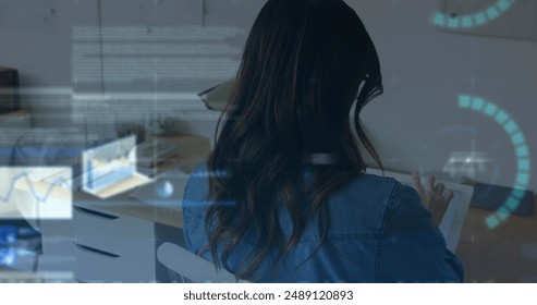 Image of financial data processing over woman using tablet. Global business, finances, computing and data processing concept digitally generated image.