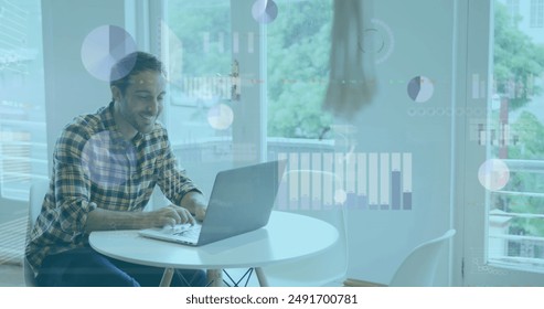 Image of financial data processing over caucasian businessman in office using laptop. Global business, finances, computing and data processing concept digitally generated image.