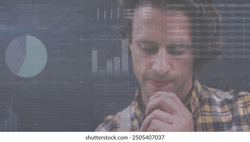 Image of financial data processing over caucasian man. global finance, business, connections, computing and data processing concept digitally generated image.