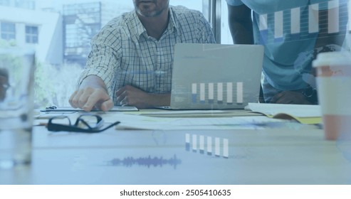 Image of financial data processing over diverse business people in office. Global finance, business, connections, computing and data processing concept digitally generated image.
