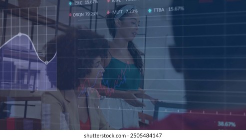 Image of financial data processing over diverse colleagues having meeting in office. Global business, computing, communication and digital interface concept digitally generated image.