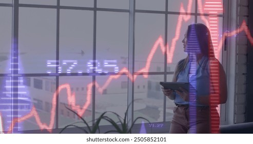 Image of financial data processing over biracial businesswoman in office. Global finance, business, connections, computing and data processing concept digitally generated image.