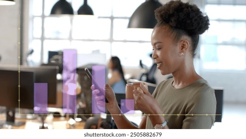 Image of financial data processing over african american businesswoman in office. Global finance, business, connections, computing and data processing concept digitally generated image.