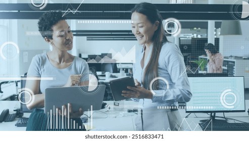 Image of financial data processing over diverse colleagues discussing work in office. Global business, finances, computing and digital interface concept digitally generated image.