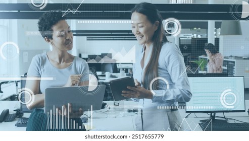 Image of financial data processing over diverse colleagues discussing work in office. Global business, finances, computing and digital interface concept digitally generated image.