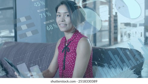 Image of financial data processing over biracial businesswoman in office. Global finance, business, connections, computing and data processing concept digitally generated image.