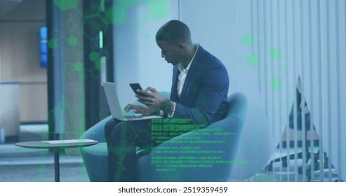 Image of financial data processing over african american businessman in office. Global finance, business, connections, computing and data processing concept digitally generated image.