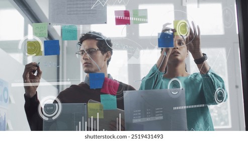 Image of financial data processing over diverse business people in office. Global finance, business, connections, computing and data processing concept digitally generated image. - Powered by Shutterstock