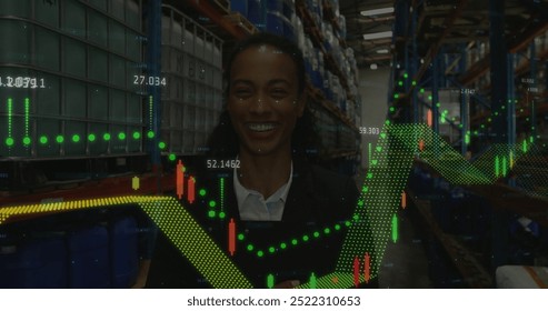 Image of financial data processing over african american businesswoman in warehouse. Global delivery, shipping, finances and digital interface concept digitally generated image.