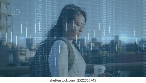 Image of financial data processing over biracial woman using smartphone in city. Global finance, business, connections, computing and data processing concept digitally generated image. - Powered by Shutterstock