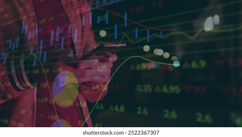 Image of financial data processing over caucasian man using smartphone in city. Global finance, business, connections, computing and data processing concept digitally generated image. - Powered by Shutterstock