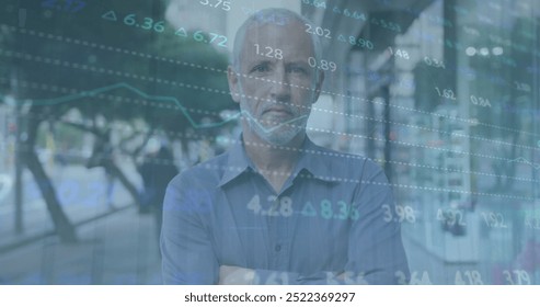 Image of financial data processing over caucasian man in city. Global finance, business, connections, computing and data processing concept digitally generated image.