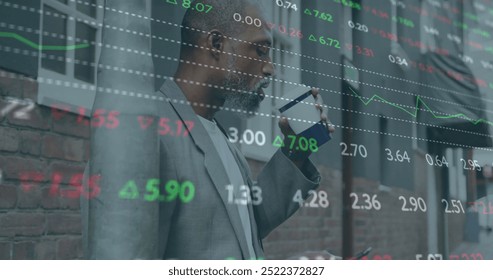 Image of financial data processing over african american man drinking coffee in city. Global finance, business, connections, computing and data processing concept digitally generated image. - Powered by Shutterstock