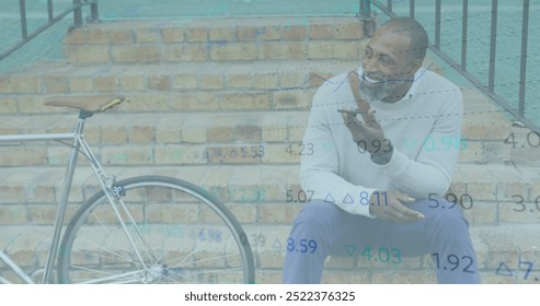 Image of financial data processing over african american man using smartphone in city. Global finance, business, connections, computing and data processing concept digitally generated image.  