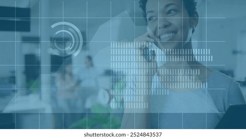 Image of financial data processing over biracial woman using smartphone in office. Global finance, business, connections, computing and data processing concept digitally generated image.