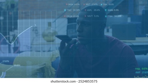 Image of financial data processing over african american businessman using smartphone. Global finance, business, connections, computing and data processing concept digitally generated image.