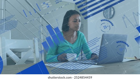 Image of financial data processing over biracial woman using laptop. Global finance, business, connections, computing and data processing concept digitally generated image.